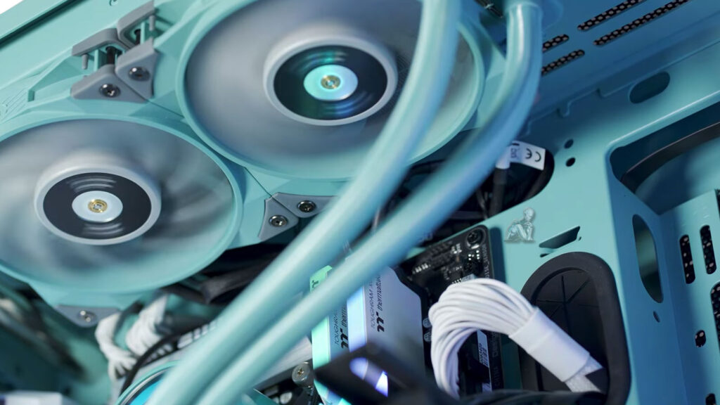 Technician checking computer cooling fans for noise issues, inspecting fan movement and airflow inside a system unit