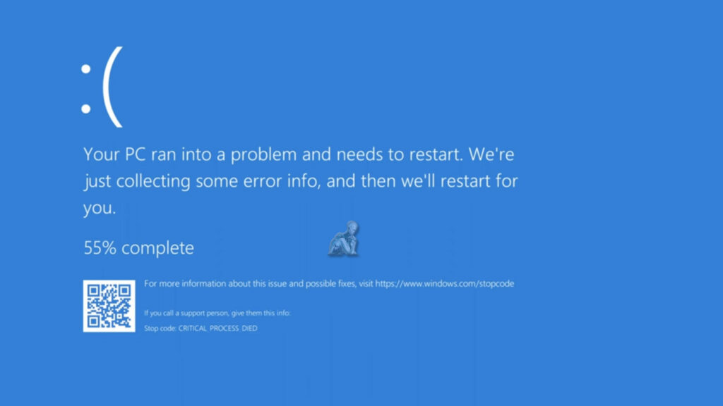 Windows 11 blue screen of death displayed on a monitor showing system error information and crash details
