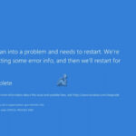Windows 11 blue screen of death displayed on a monitor showing system error information and crash details