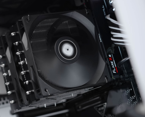 Large CPU heatsink with dual fans actively cooling a gaming PC processor during operation