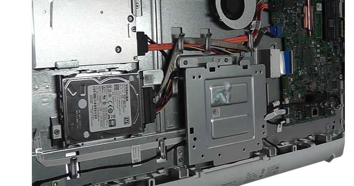 Opened all-in-one computer with internal components exposed while the hard drive is being removed for data recovery work