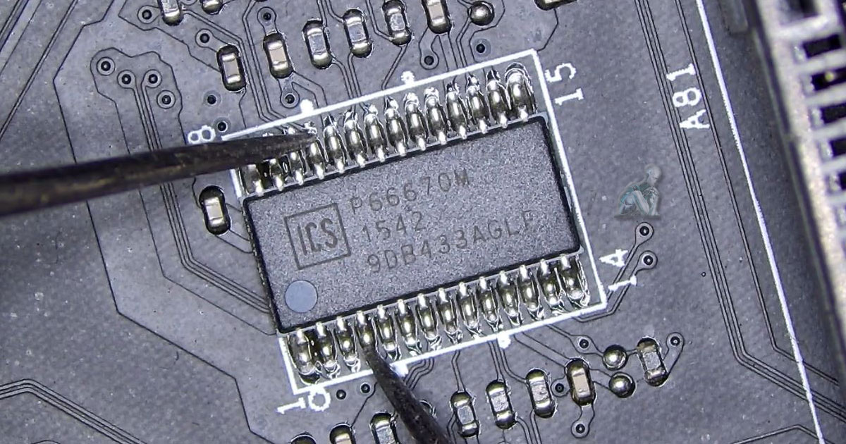 Computer memory slot area on a motherboard with damaged integrated circuits affecting the surrounding board section