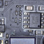 Circuit board section showing a break in continuity along a data transfer pathway, affecting signal flow between components