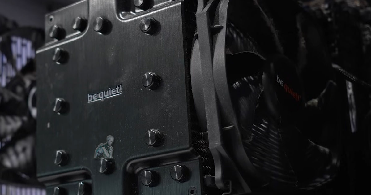 Be quiet CPU heat sink covered in dust and debris inside a desktop computer, being cleaned as part of routine maintenance