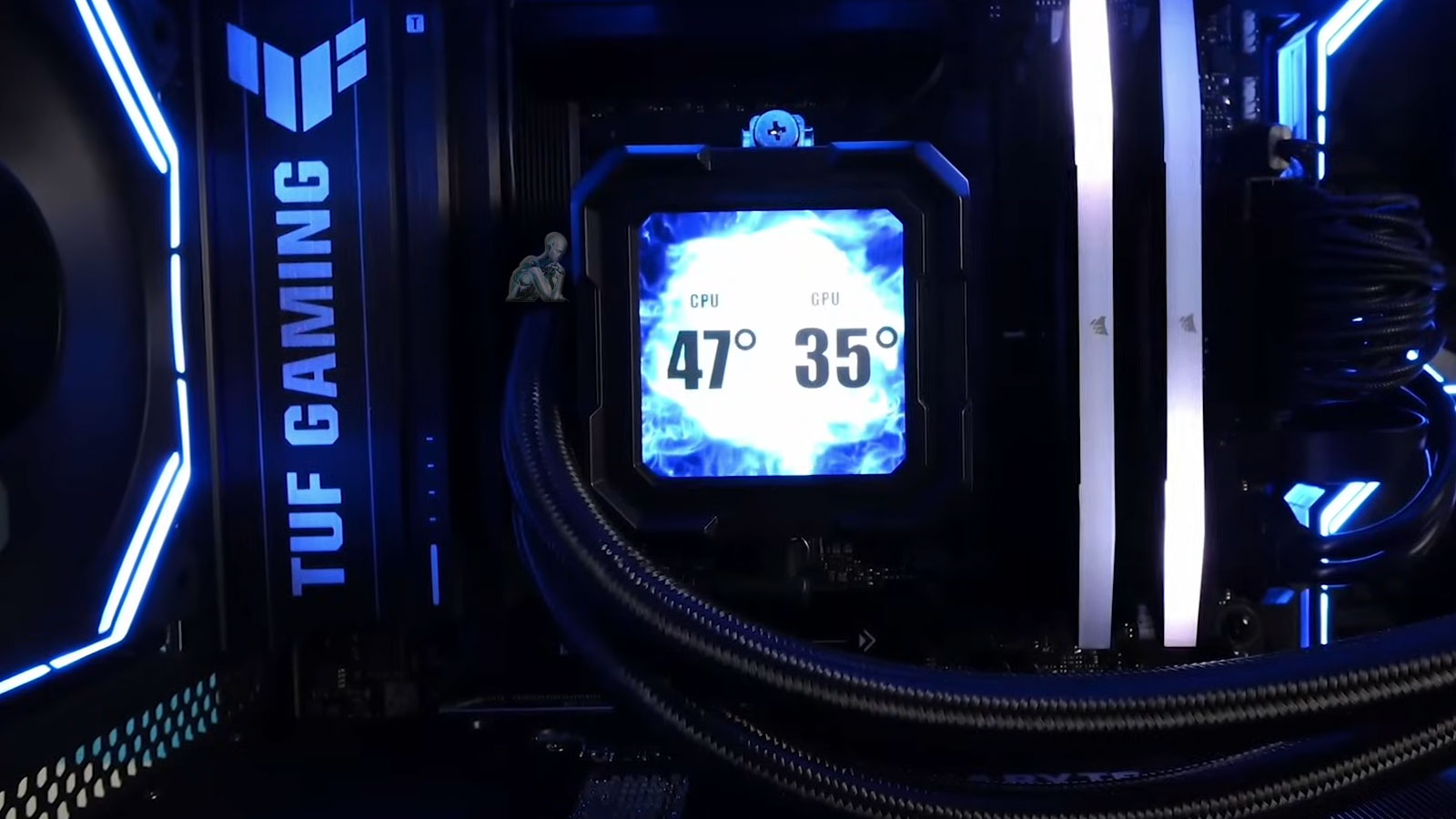 TUF Gaming motherboard installed in a desktop build with a liquid cooling system connected for CPU temperature control