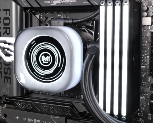 ASUS ROG Strix motherboard inside a custom-built gaming PC running with visible components, active lighting, and system operation