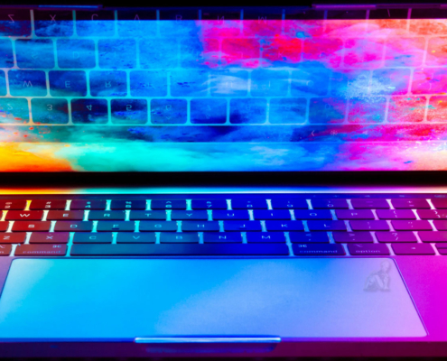 Laptop open with colorful lighting across the keyboard and display