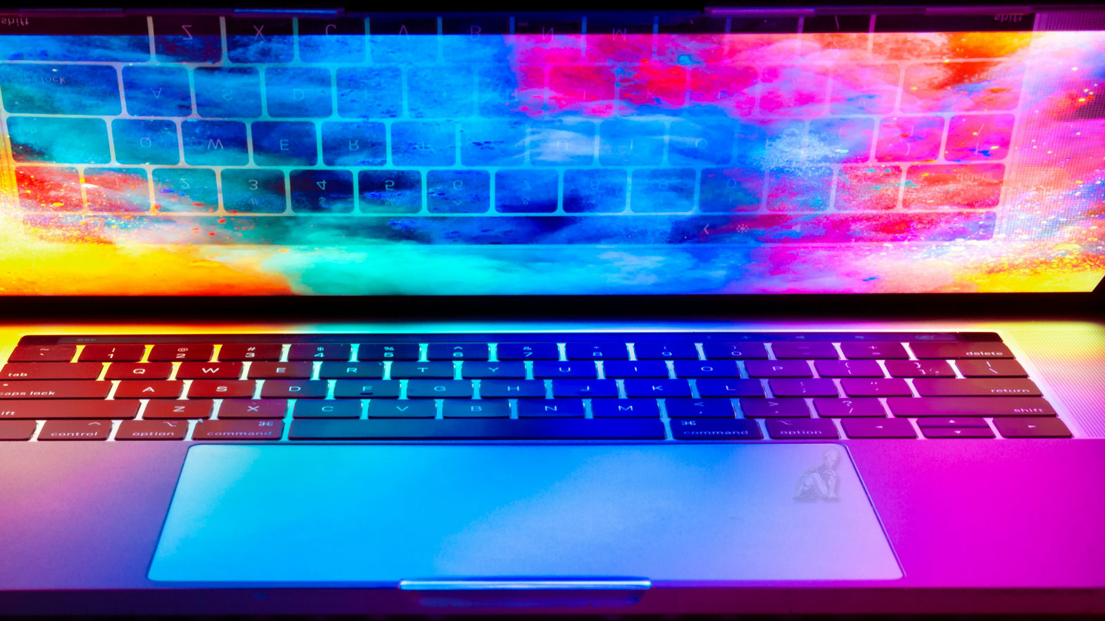 Laptop open with colorful lighting across the keyboard and display