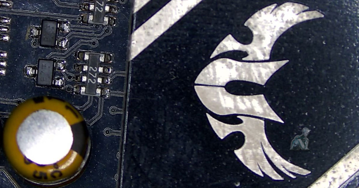 Computer-Repair-Expertise-for-Home-and-Gaming-Systems-in-Miami-Gardens-FL Detailed view of a gaming motherboard highlighting a damaged capacitor with a swollen top near surrounding chips and printed circuit pathways