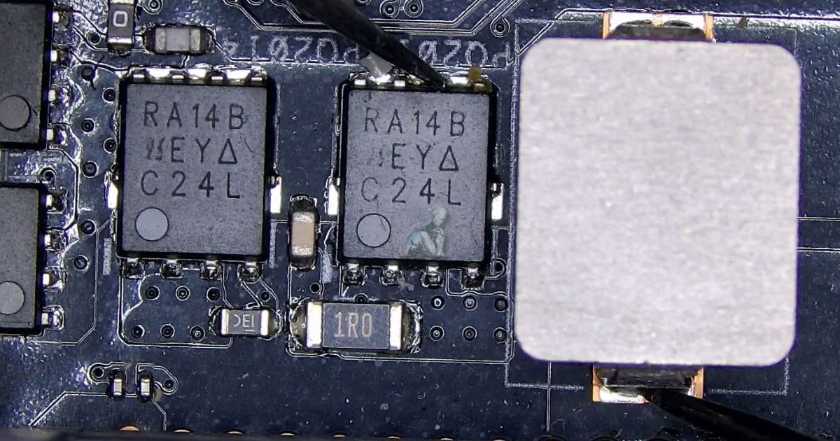 Board-level inspection of a MOSFET near an inductor coil while multimeter probes test for a direct short, with surrounding components and copper traces visible