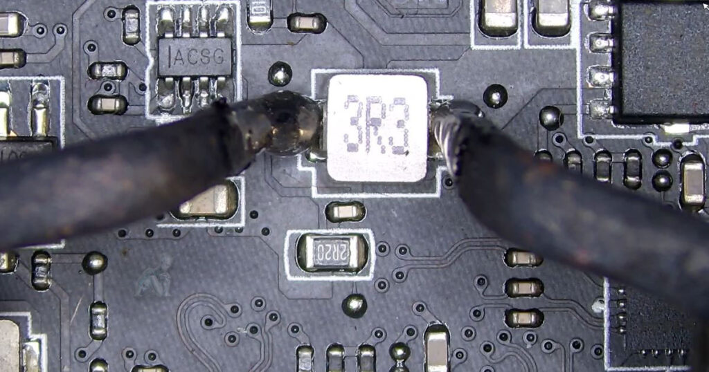 Heated tweezers gripping and lifting a component from a circuit board, showing a rapid removal process during electronic repair work