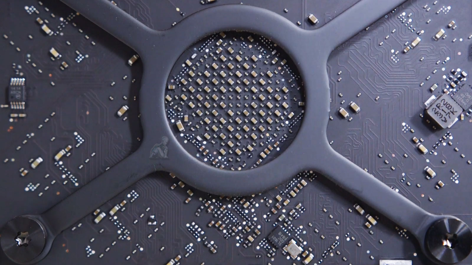 Open 2014 Mac Pro showing internal circuit board and single central fan assembly