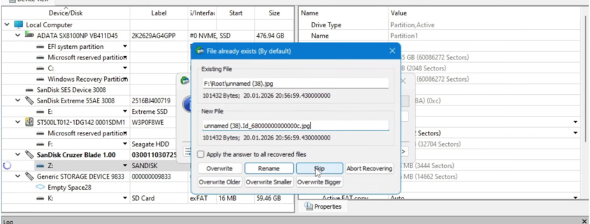 Laptop screen displaying data recovery software scanning a storage device and listing recoverable files in progress