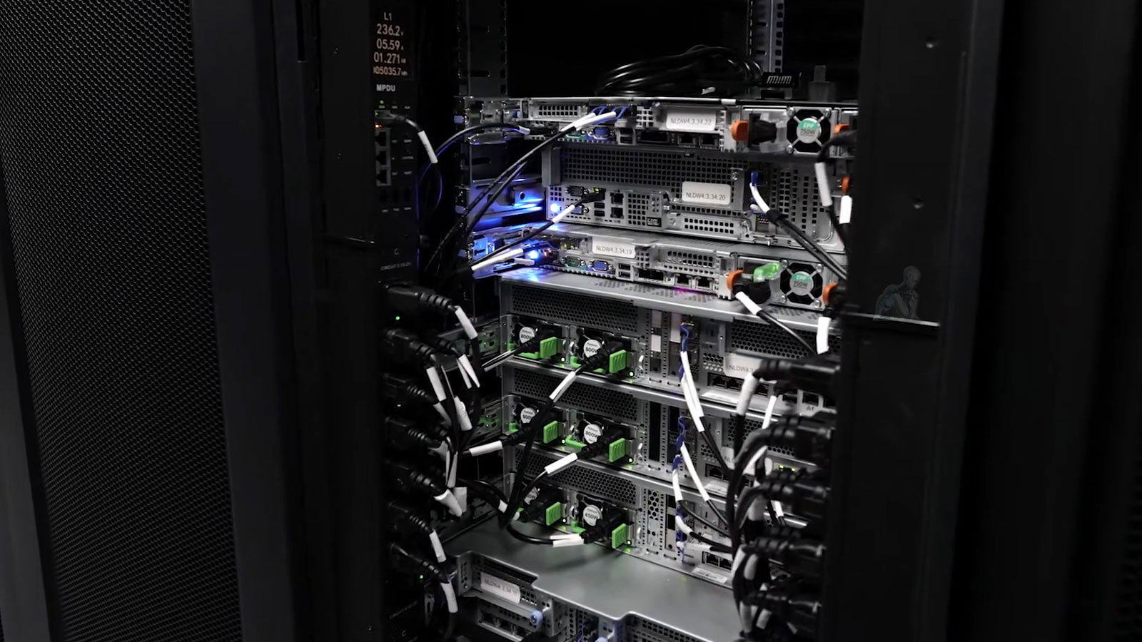 Server cabinet with organized Ethernet cables connected to networking equipment, showing structured wiring inside a rack setup