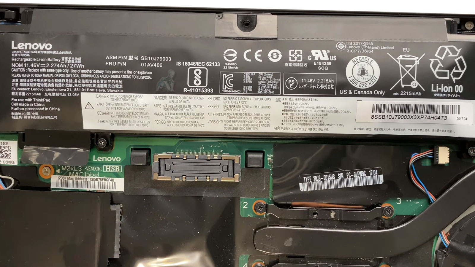 Laptop-Battery-Secured-for-Replacement Open laptop with back cover removed showing Lenovo battery secured with screws ready for replacement