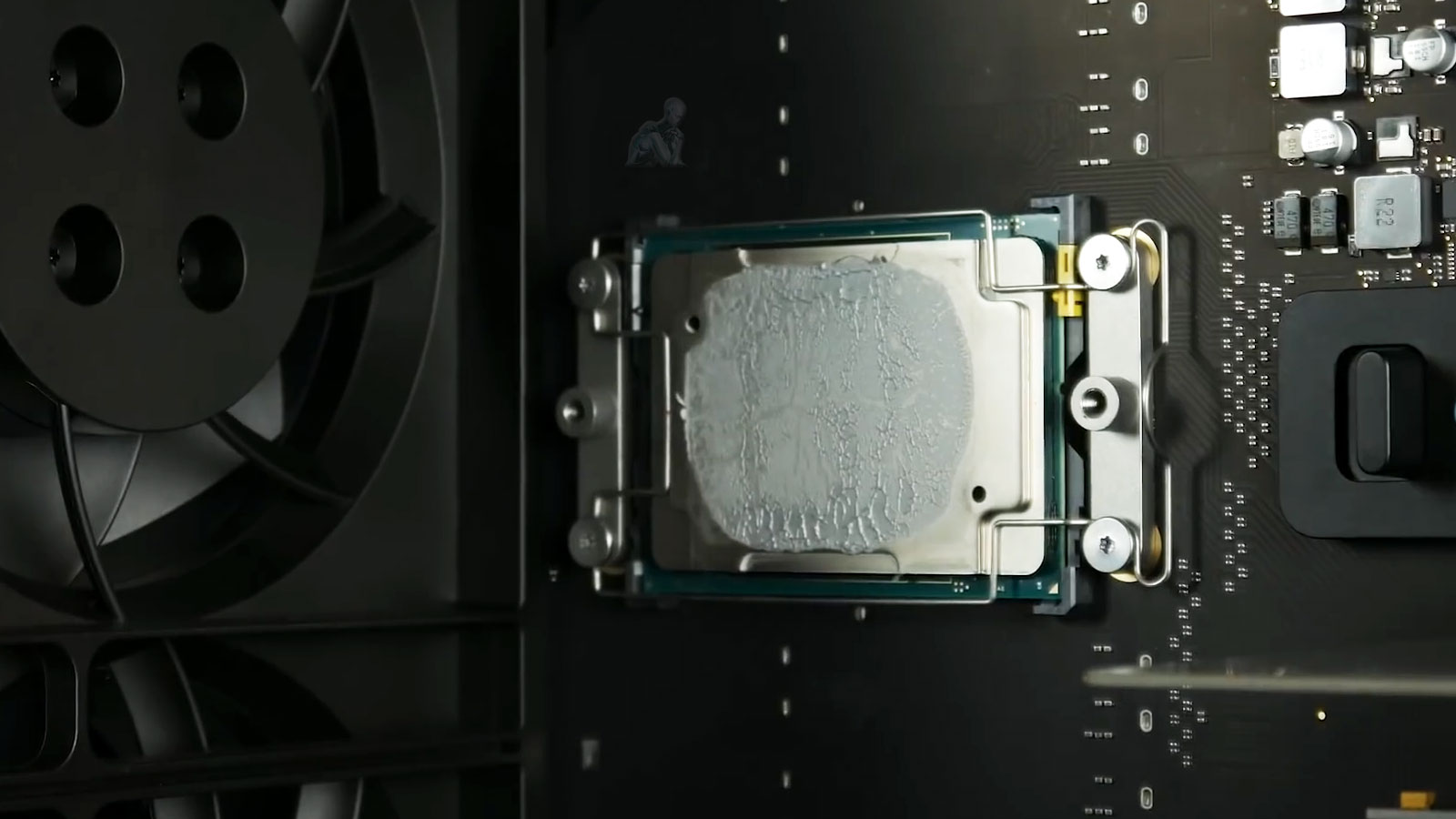 Mac Pro logic board with CPU installed and heatsink removed for repair evaluation