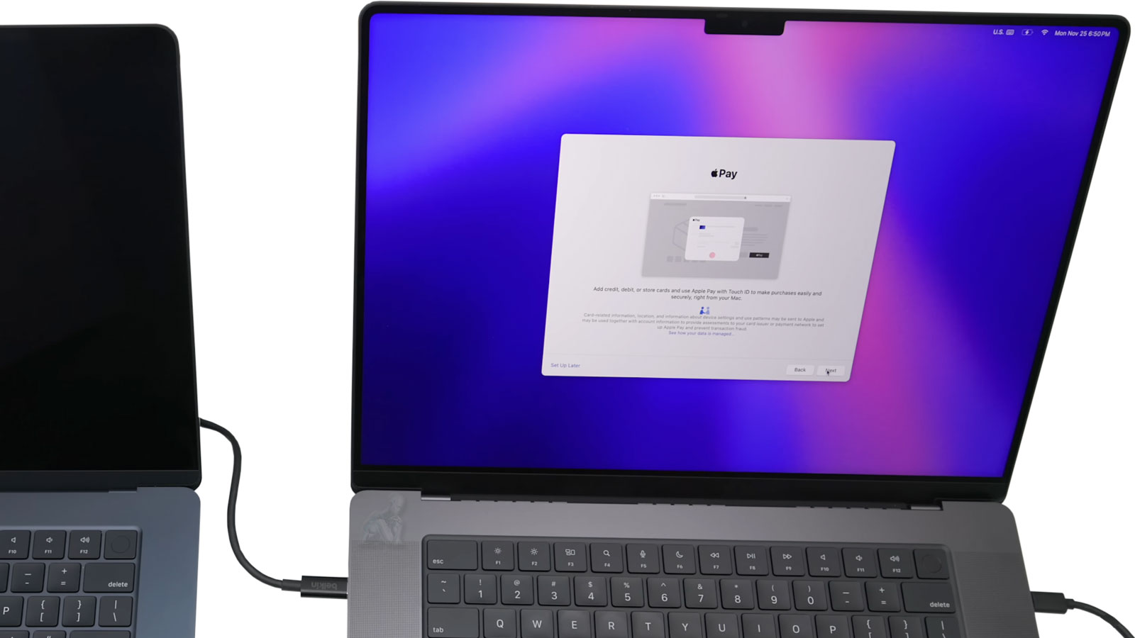 Mac-Pro-to-Mac-Data-Transfer-and-Migration-Setup Two Mac computers connected transferring data between systems during migration process