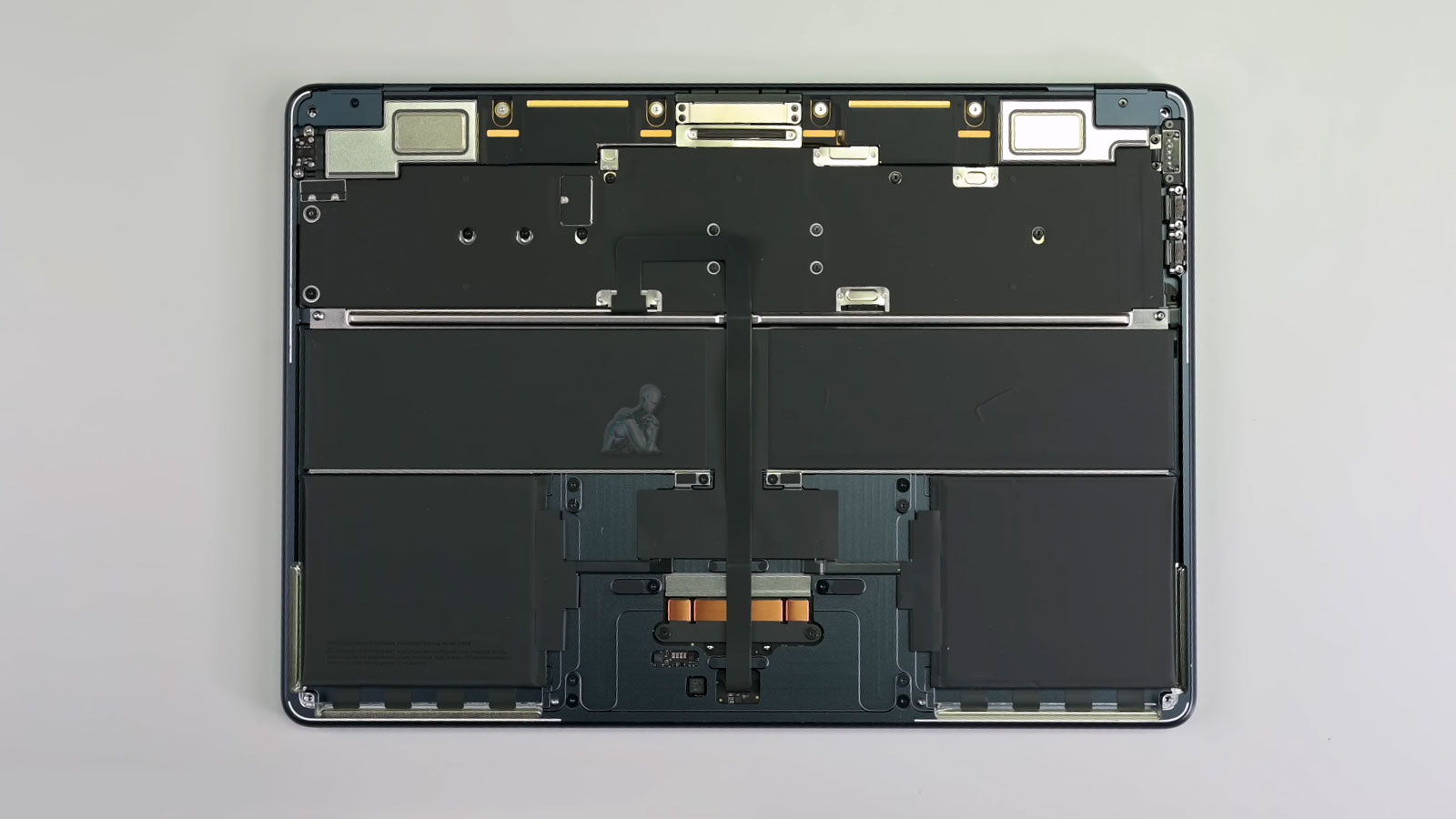 MacBook Air with back cover removed during diagnostic inspection in Miami