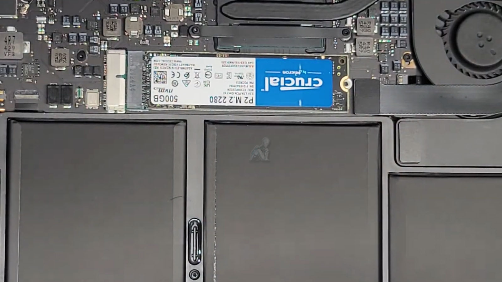 MacBook Air opened with visible 500GB M.2 SSD used for data storage