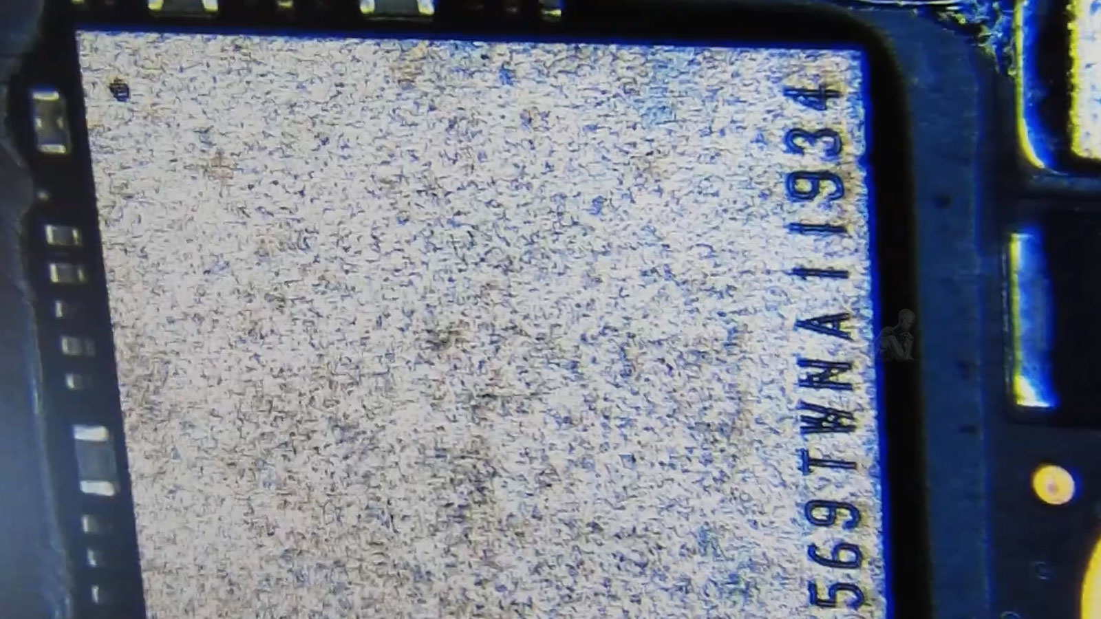 Close-up of MacBook Pro logic board showing NAND flash storage chip used for data recovery