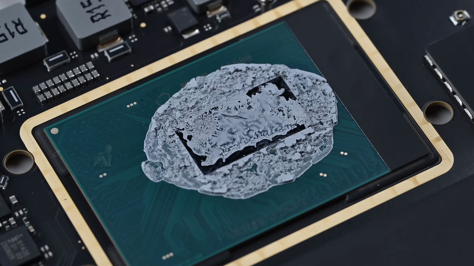 MacBook Pro CPU with dried thermal paste during cleaning and maintenance in Miami