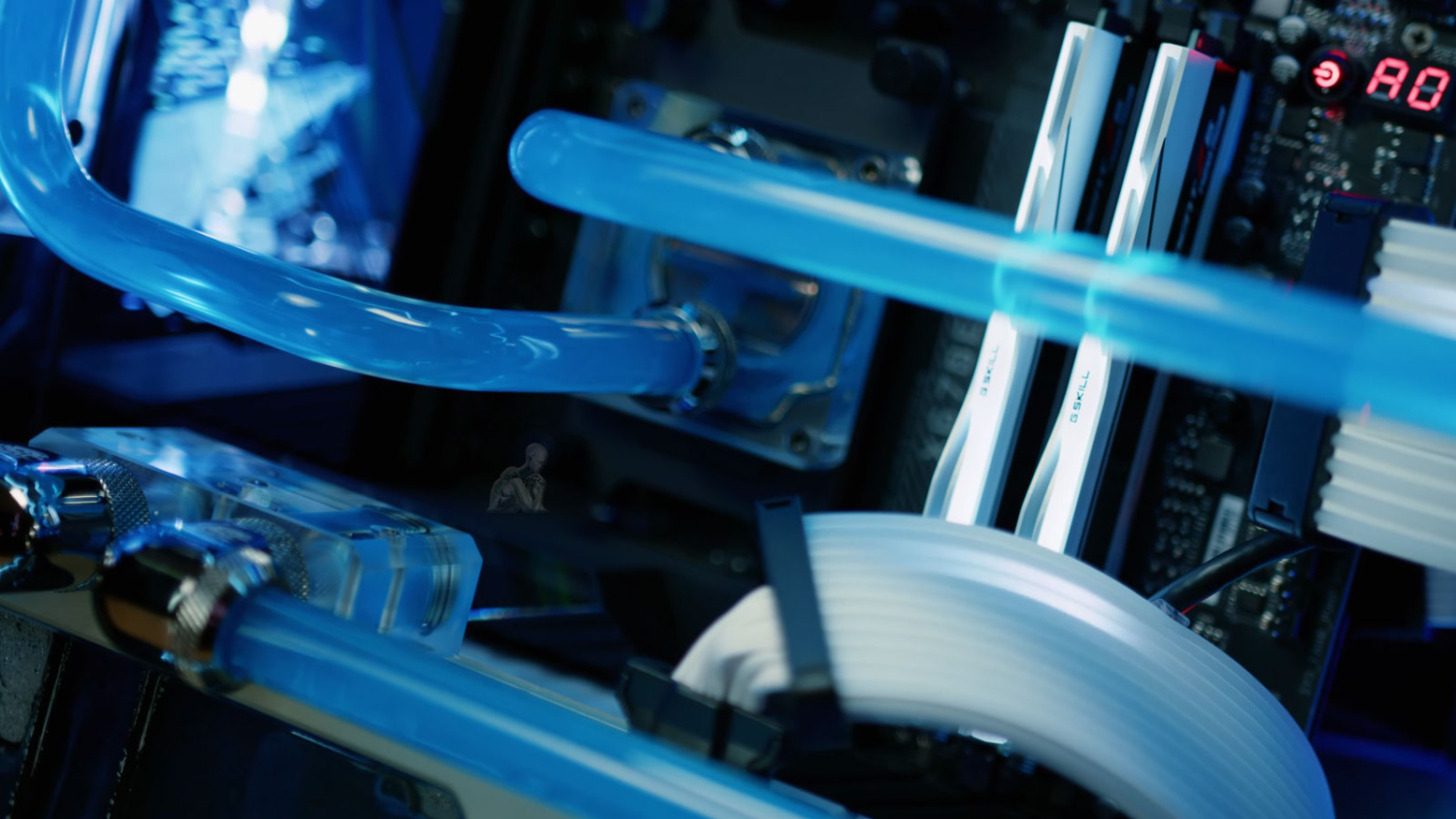 Open gaming PC with custom loop water cooling and blue hard tubing during gaming PC services in Miami