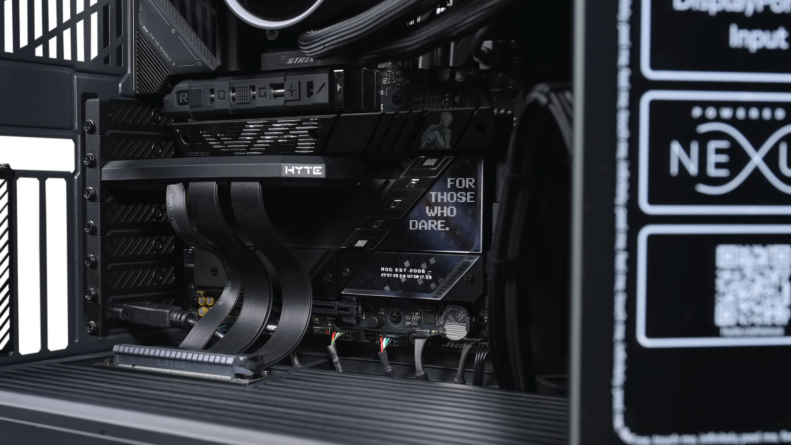 Gaming PC with graphics card being installed using a vertical GPU mount adapter