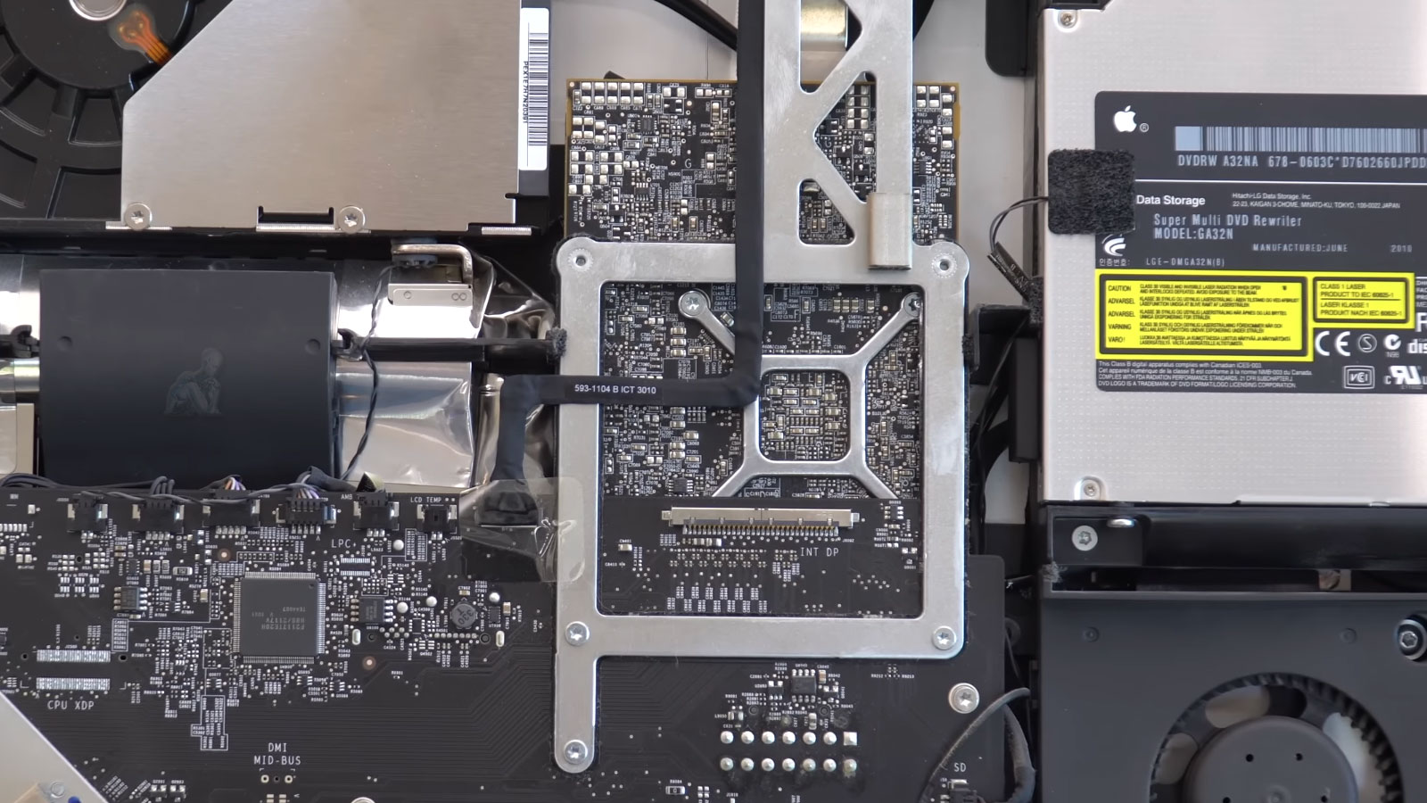 Open iMac with display removed showing graphics card area on logic board during GPU repair