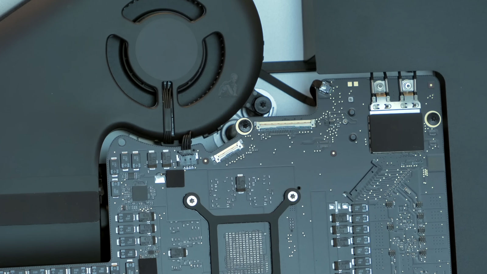 Open iMac showing motherboard and internal components ready for hardware upgrades