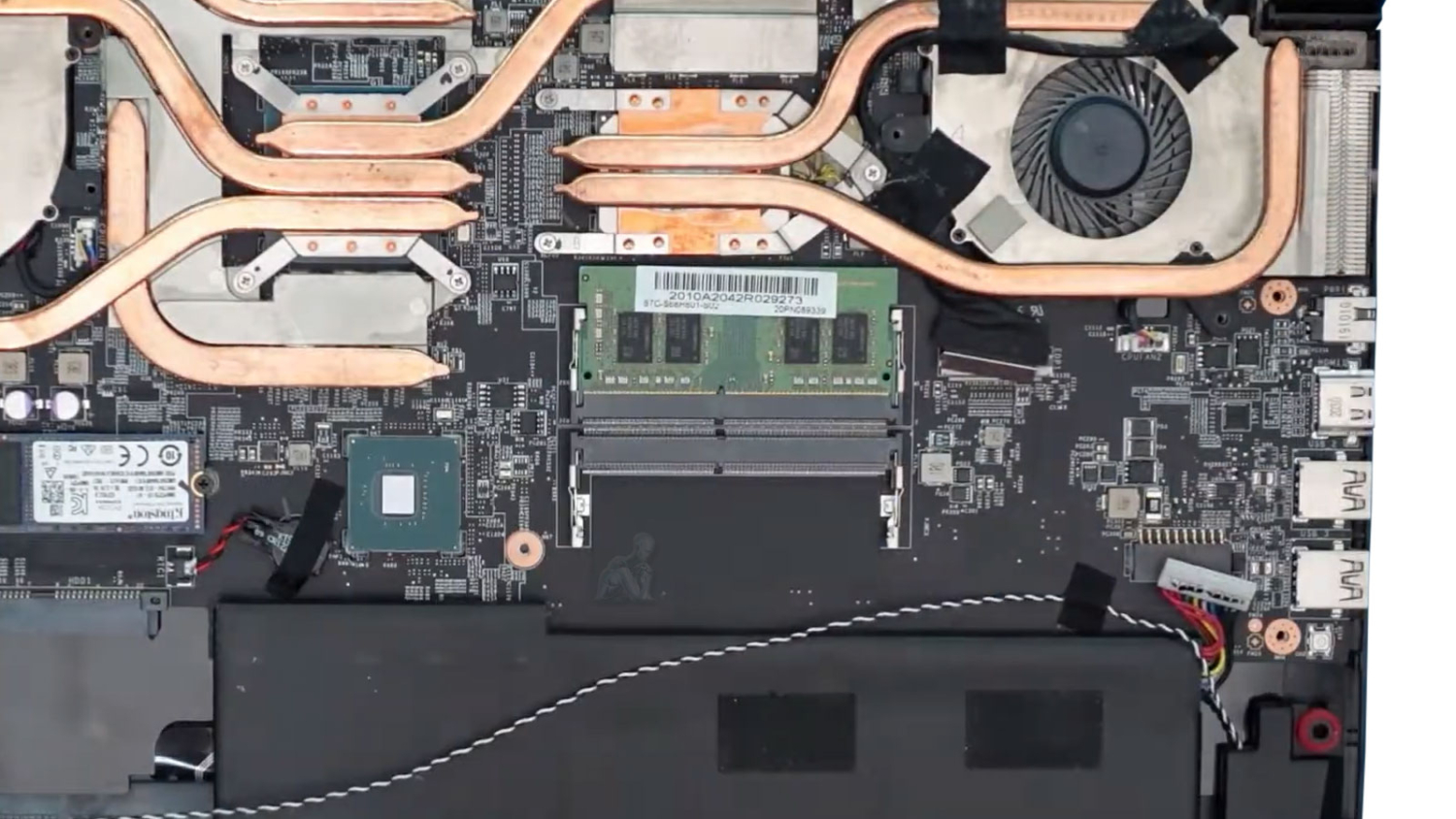 Open laptop showing DC jack connection during laptop charging port repair in Miami