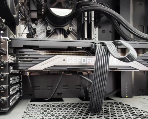 Open desktop PC showing heavy dust buildup on the fans and internal components restricting airflow.