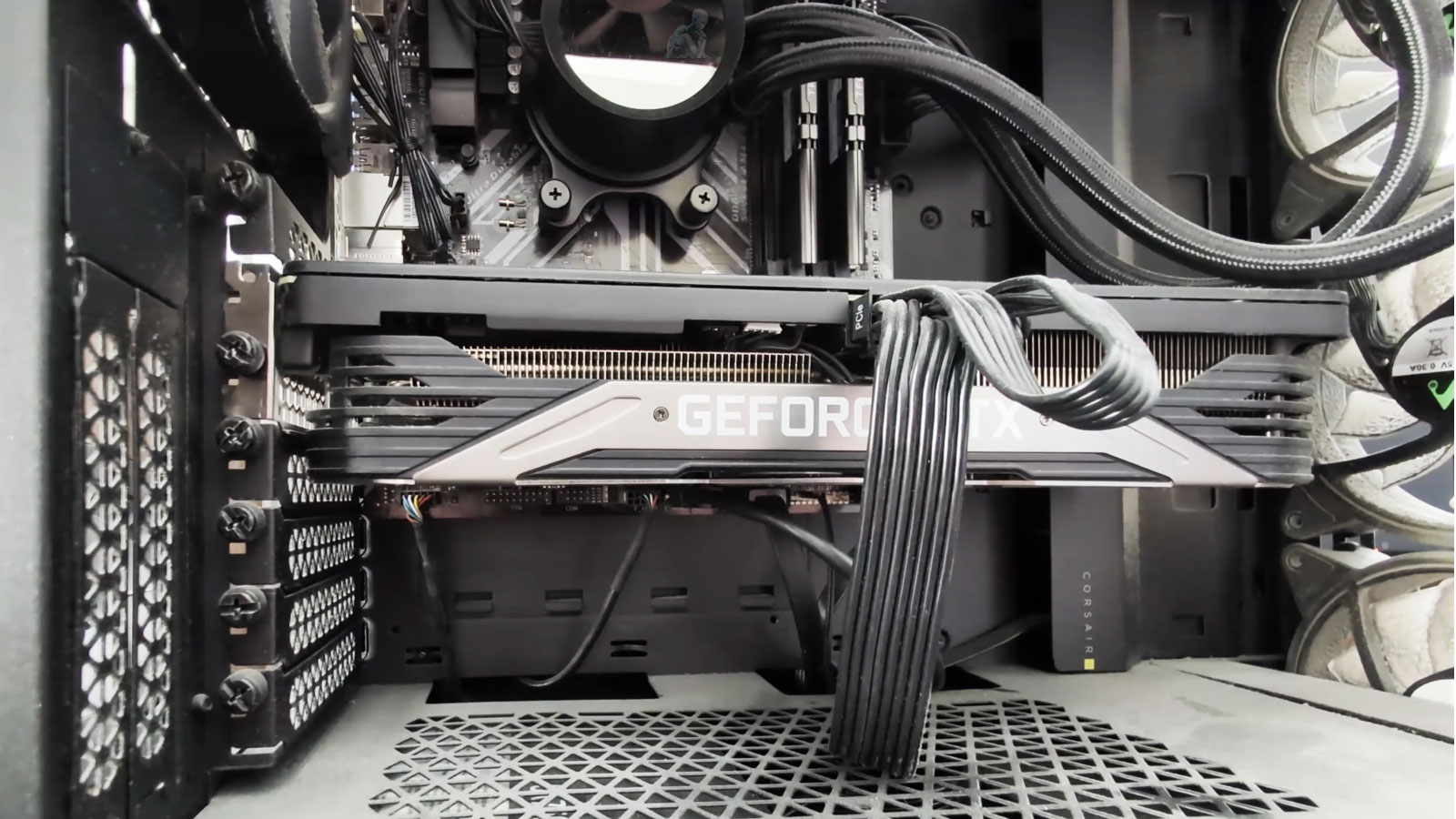 dust-buildup-poor-airflow-inside-pc Open desktop PC showing heavy dust buildup on the fans and internal components restricting airflow.
